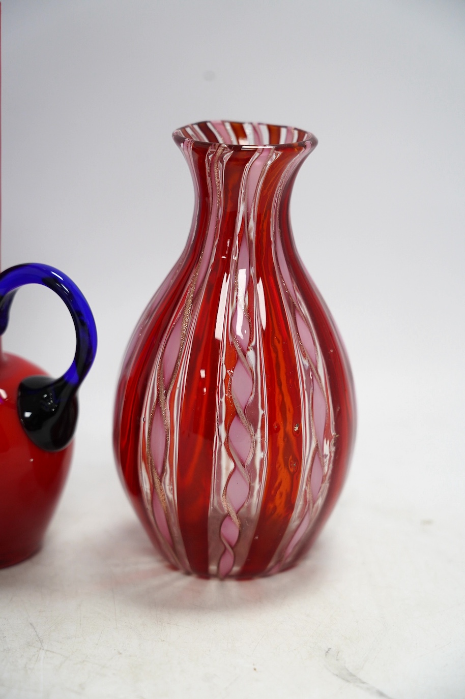 A Murano glass vase with inset copper aventurine, two other European glass vases and a similar ceramic vase, tallest 24cm. Condition - good